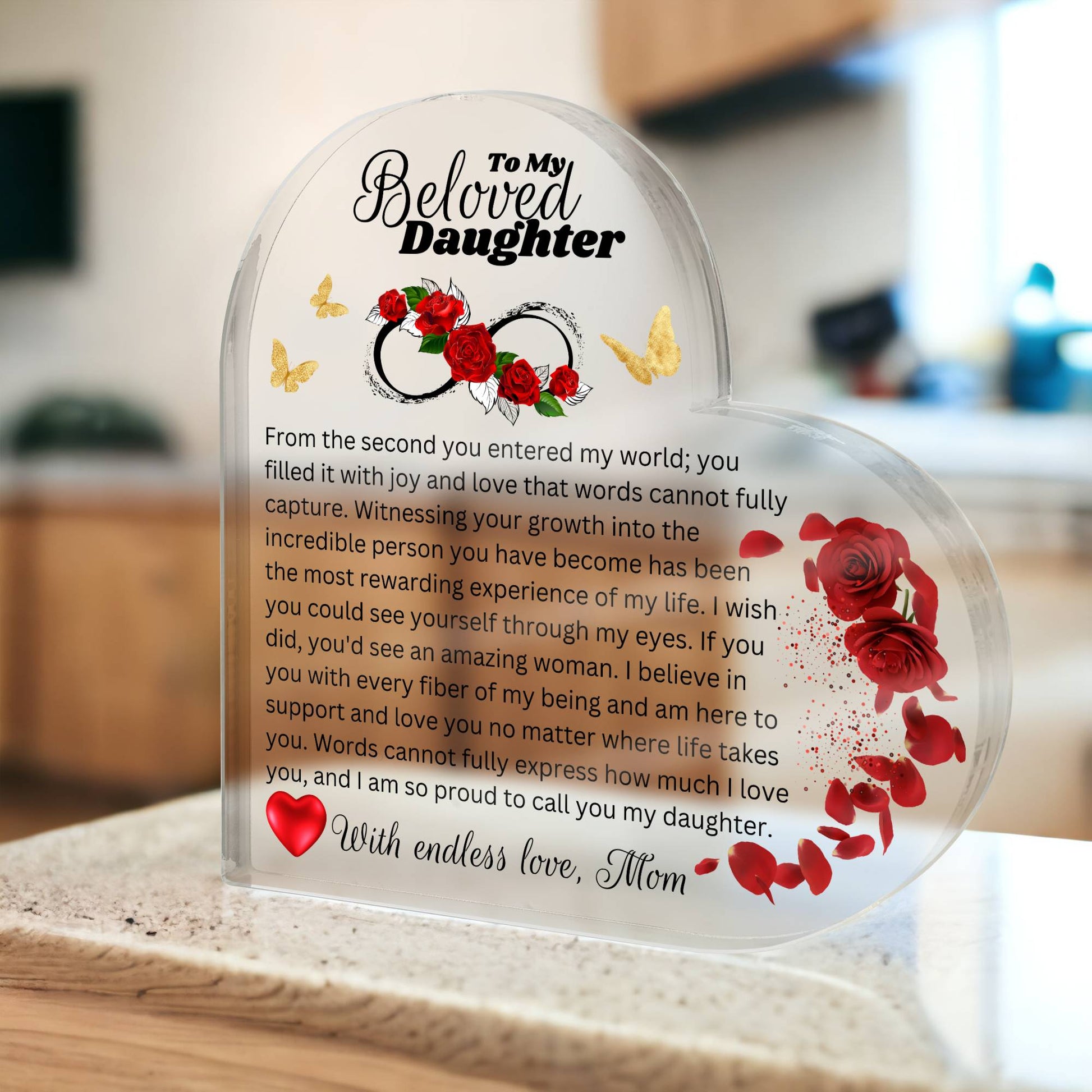 Heart shaped Acrylic plaque printed with a heartfelt message to my daughter from Mom. a gift for daughter in kitchen background