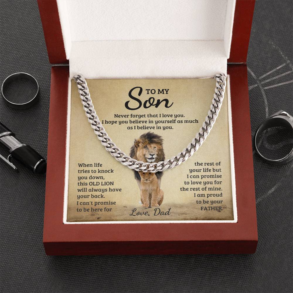 A luxury box with an Inspirational quote and a necklace for a son from his father with a lion image. In a grey background.