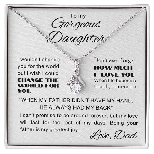 white gold necklace with a sparkling crystal pendant, displayed on a heartfelt message card from a father to his daughter.