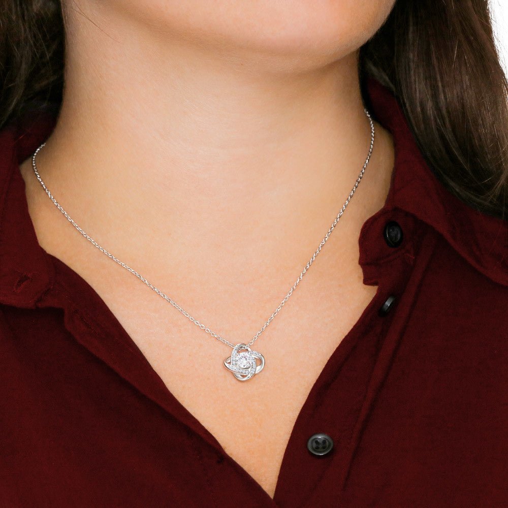 A close look to a pendant wearing by a woman