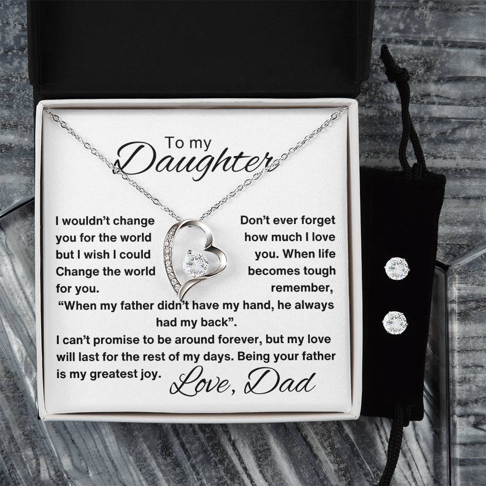 A gift box containing a necklace with a heart pendant. The necklace comes with a card that reads, "To My Daughter: I wouldn't change you for the world, but I wish I could change the world for you. Love, Dad."in grey background