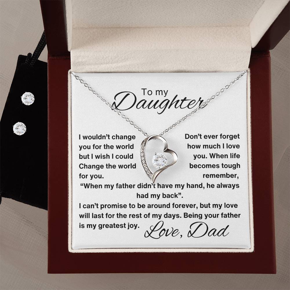 A luxury gift box containing a necklace with a heart pendant. The necklace comes with a card that reads, "To My Daughter: I wouldn't change you for the world, but I wish I could change the world for you. Love, Dad."in white background