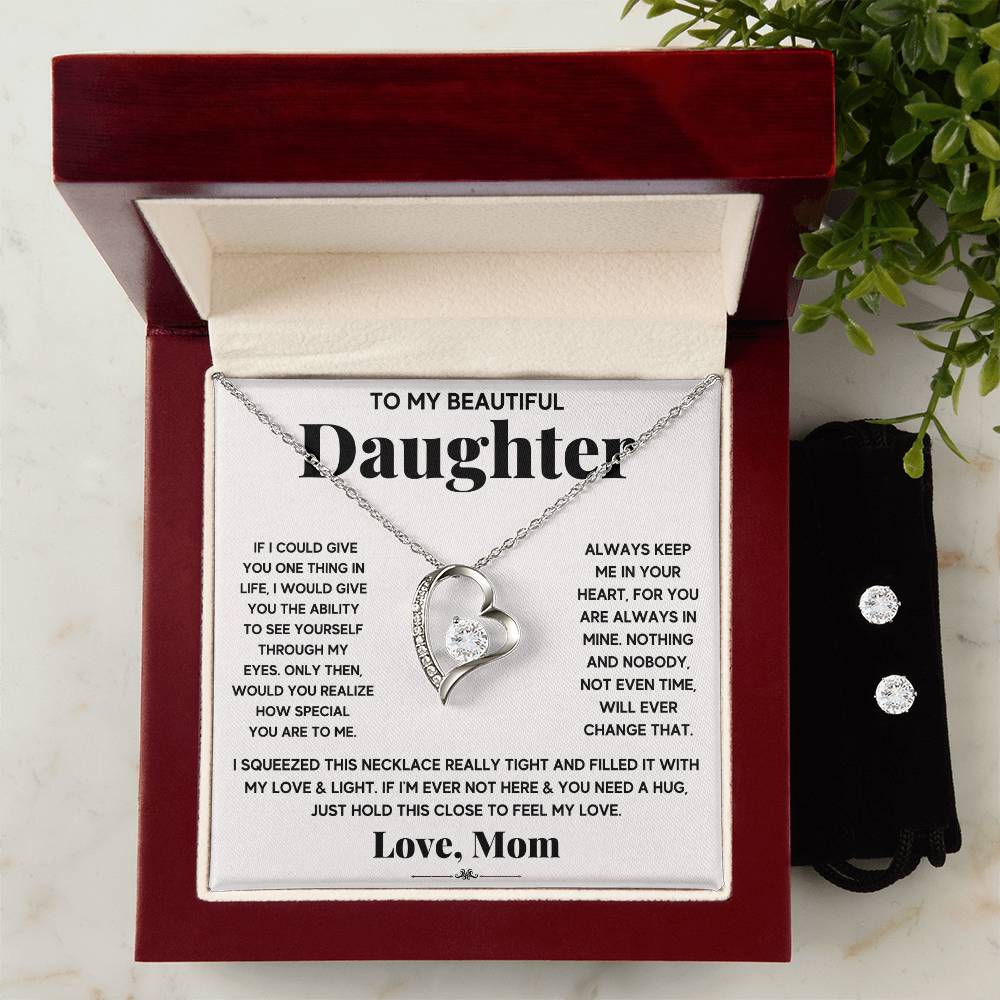 A silver heart necklace and earrings set with a heartfelt message for a special daughter.