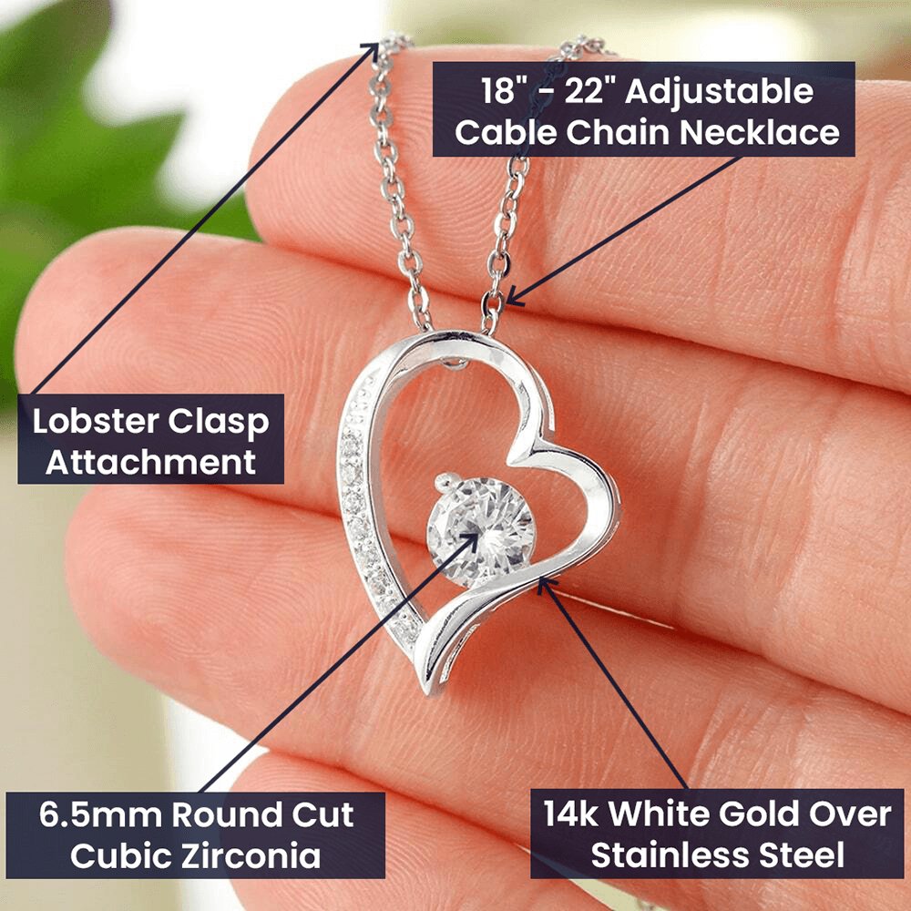 14k white heart necklace displayed  on human hand with its features explained.