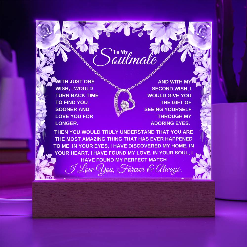 A lit wooden display case acrylic plaque with a heart-shaped pendant lighted up in purple The text inside reads, "To My Soulmate" it'a a custom soulmate gift for christmas or birthday