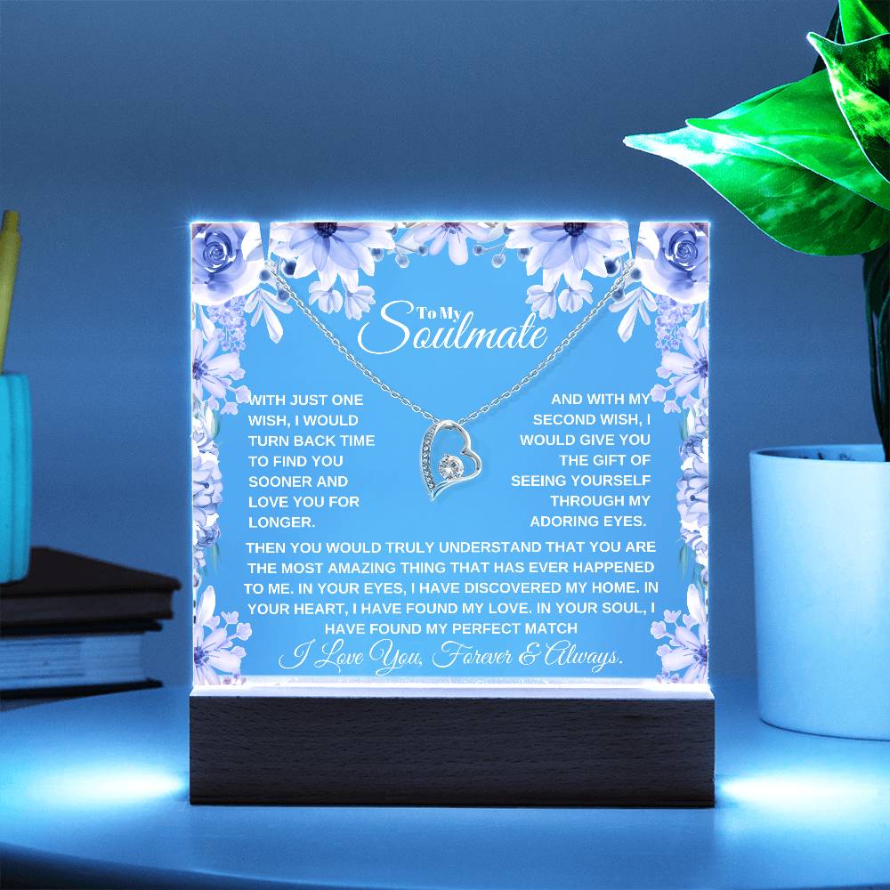 A lit wooden display case acrylic plaque with a heart-shaped pendant lighted up in blue The text inside reads, "To My Soulmate" it'a a custom soulmate gift for christmas or birthday