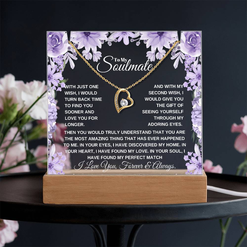 A lit wooden display case acrylic plaque with a purple background and a yellow gold heart-shaped pendant. The text inside reads, "To My Soulmate" it'a a custom soulmate gift 