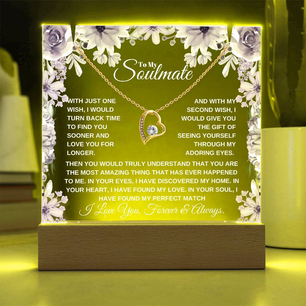 A lit wooden display case acrylic plaque with a gold heart-shaped pendant lighted up in yellow The text inside reads, "To My Soulmate" it'a a custom soulmate gift for christmas or birthday